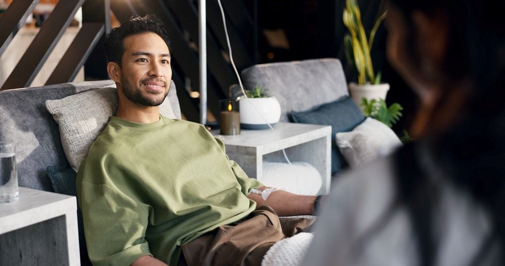 A man getting a stem cell therapy drip in Thailand