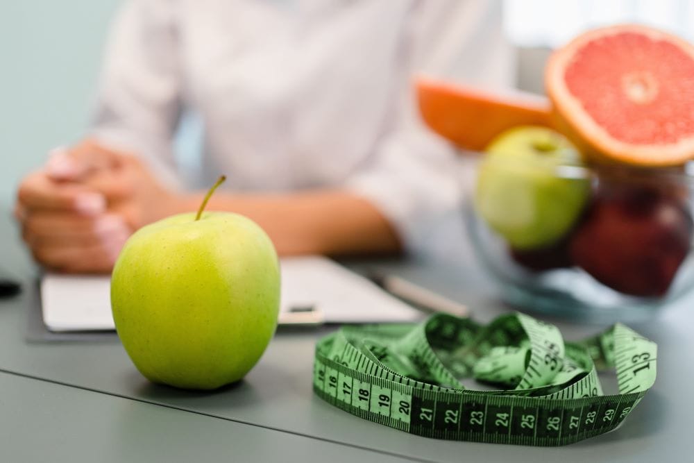 A physician advising a patient on effective weight loss strategies.